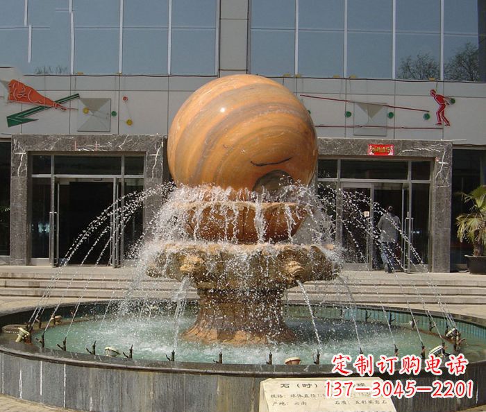 黄冈石来运转球晚霞红风水球石雕