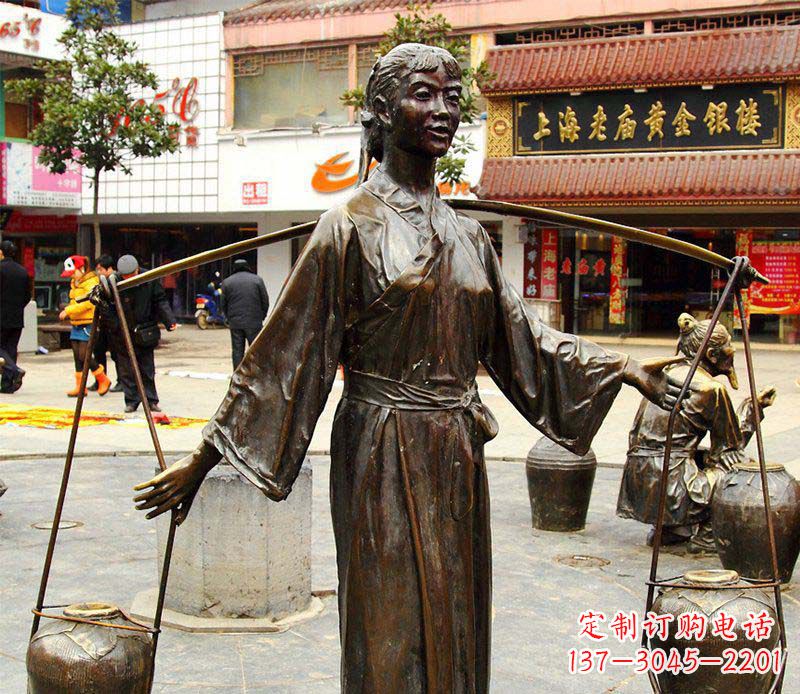 黄冈挑着罐子的古代女人铜雕